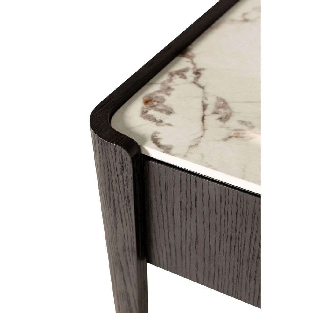 Corner of a table with marble top and wooden base