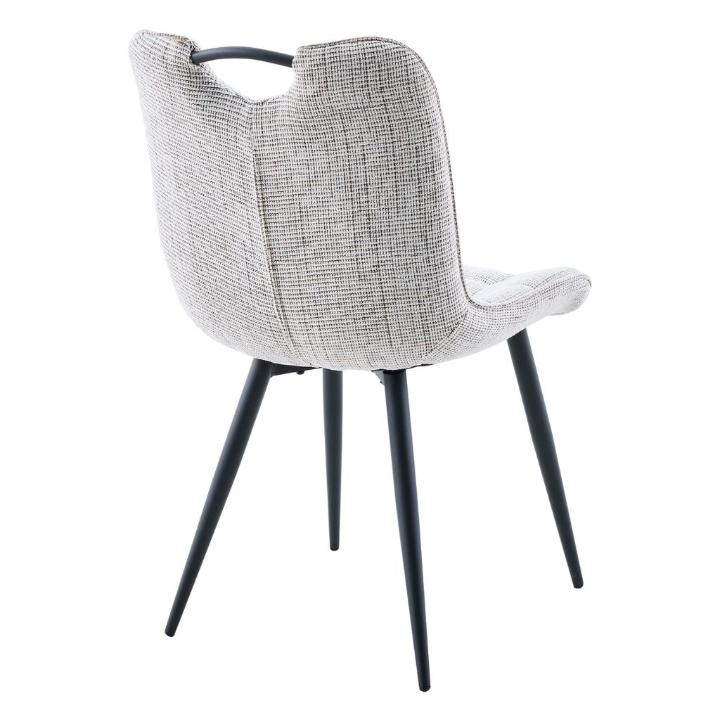 Biscuit textured chair with black legs on a white background