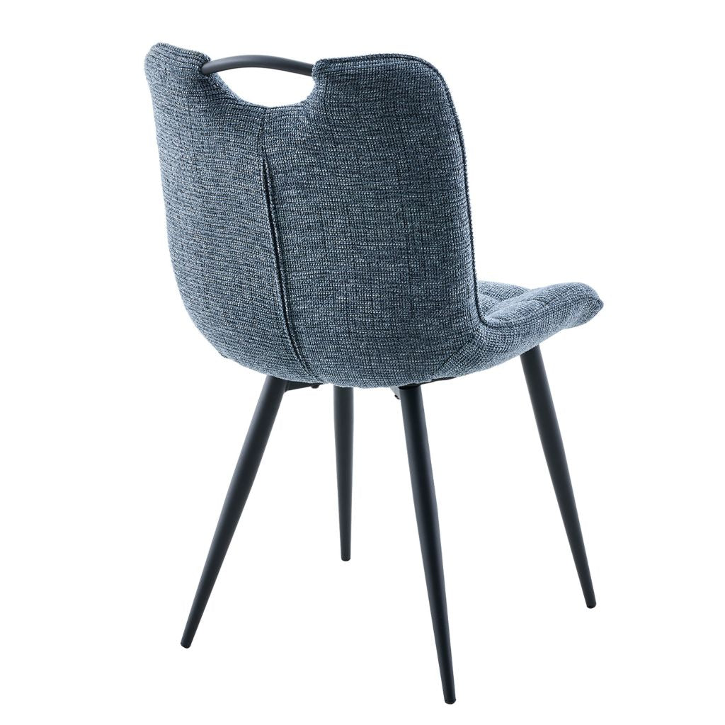 Blue upholstered chair with black legs on a white background