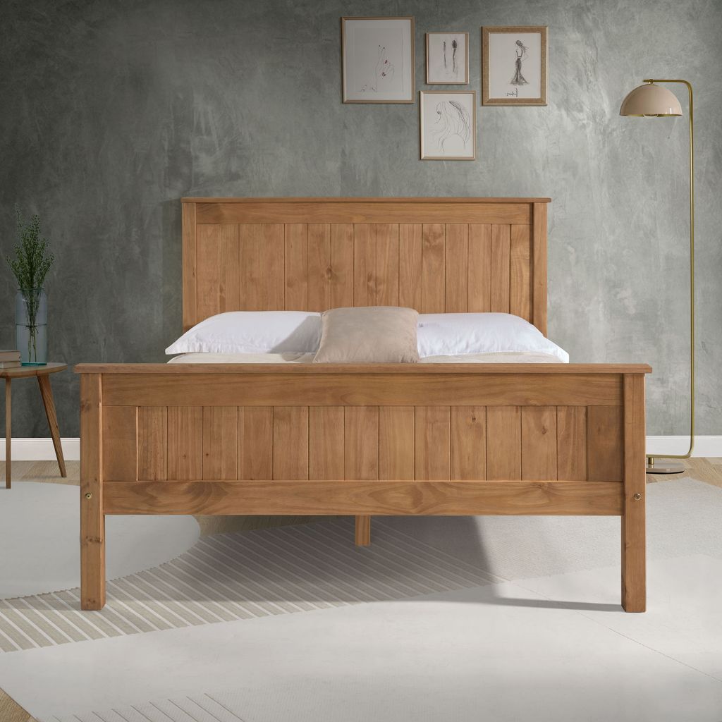 Wooden bed in a room with a gray wall and decorative elements.