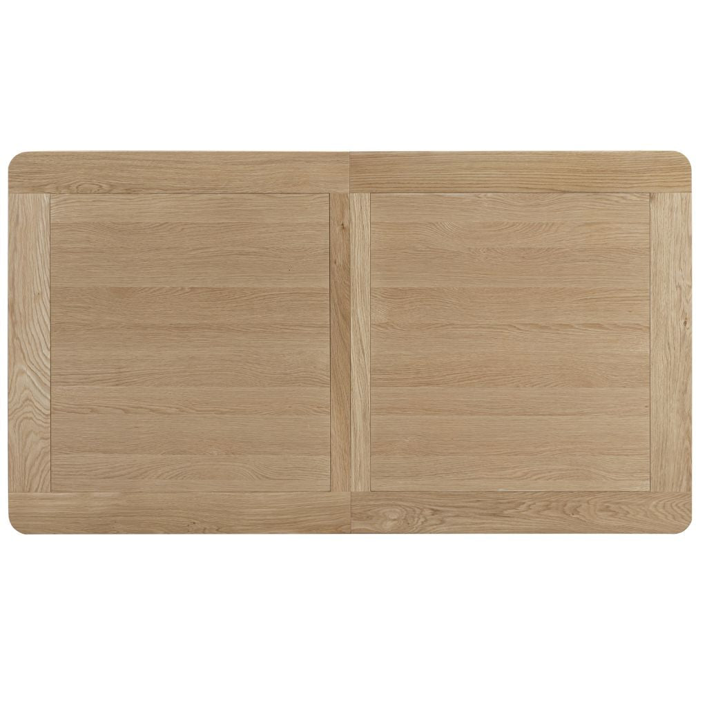  A central panel divided gives the table top visual interest while concealing the extension available