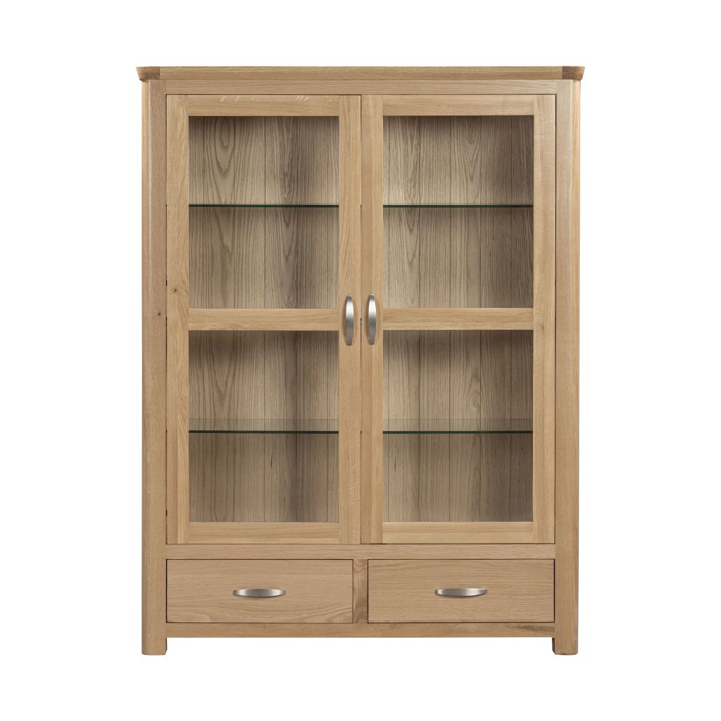 A light oak wood display cabinet with two glass-front doors, three glass shelves inside, two silver door handles, and two drawers at the bottom with silver handles.