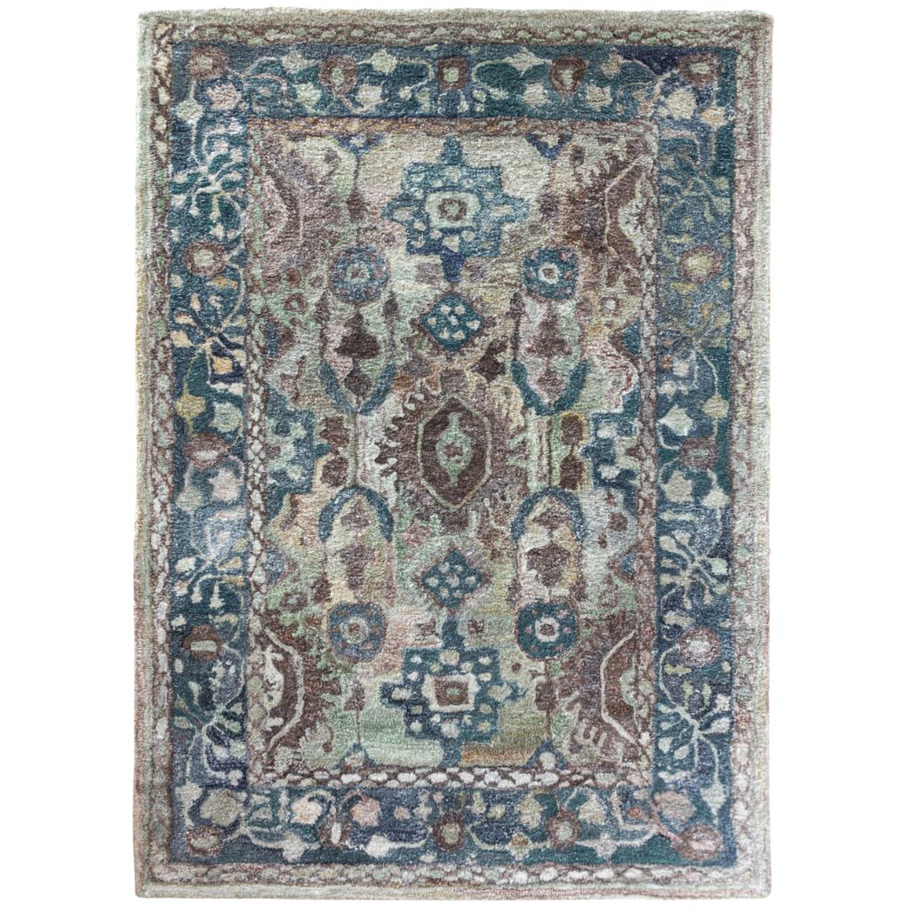 Decorative rug with intricate patterns on a white background