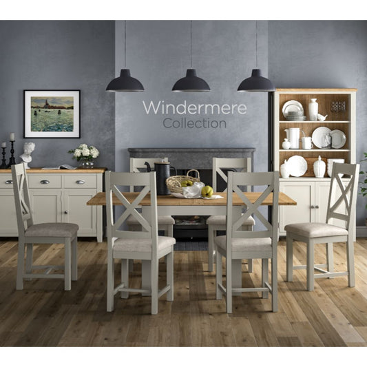 Dining room with wooden table and chairs, featuring the Windermere Collection.
