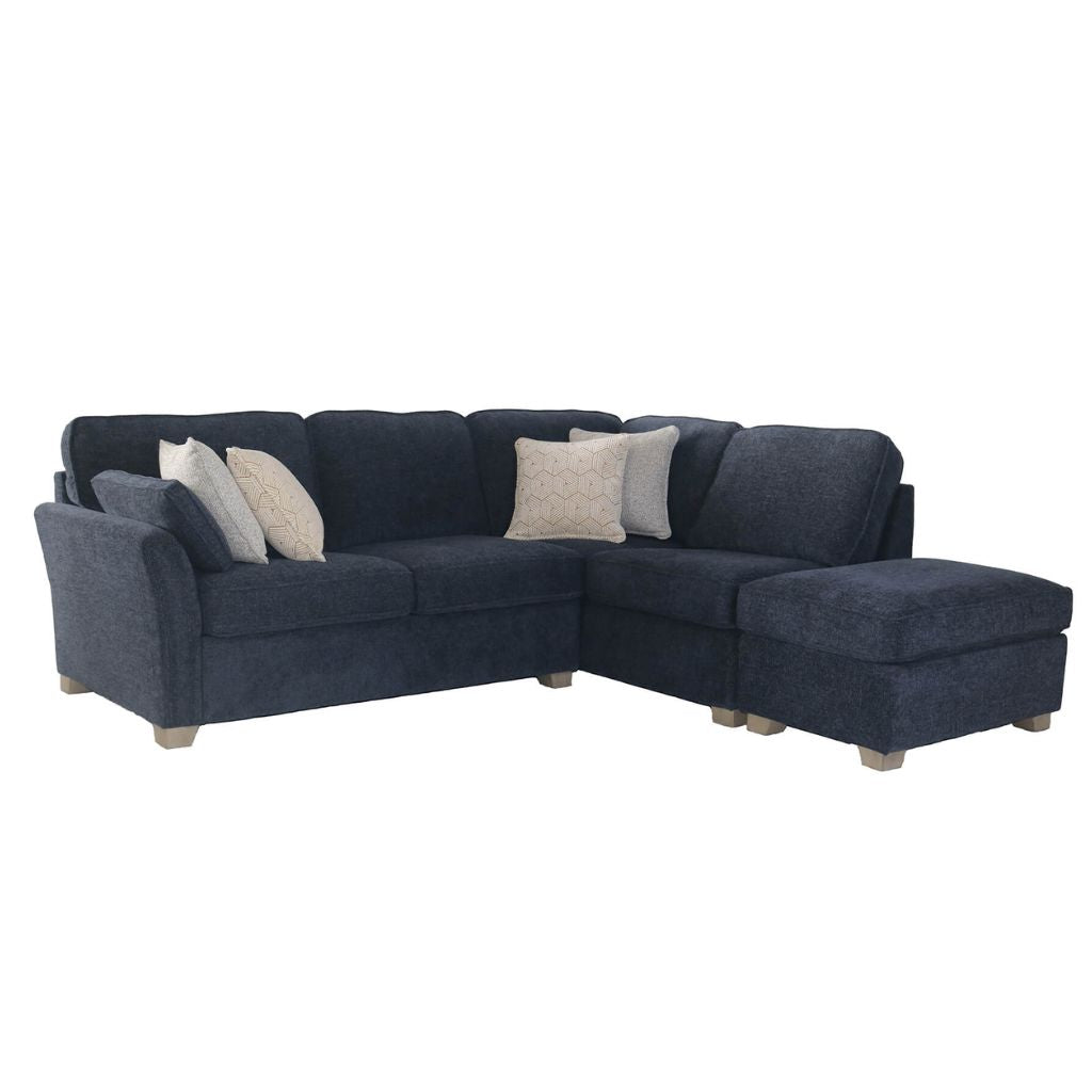 Navy blue sectional sofa with cushions on a white background